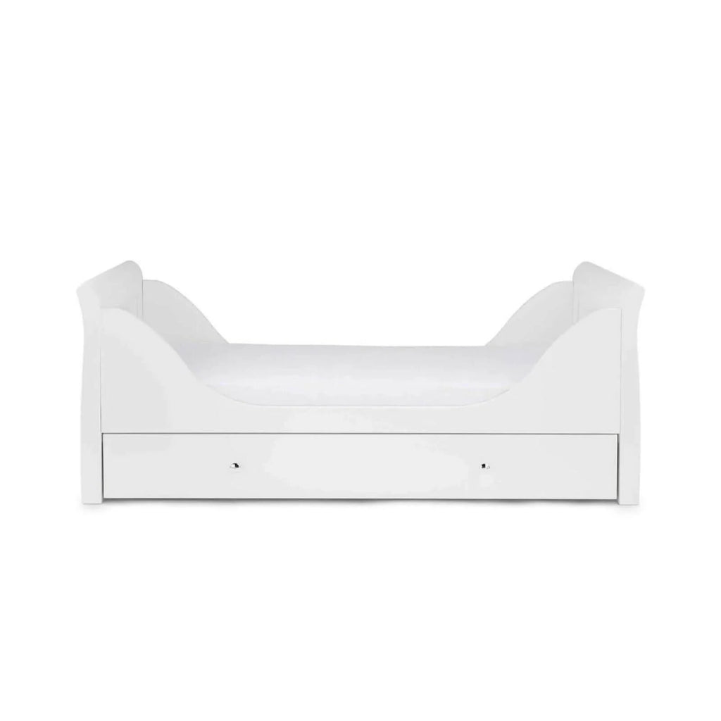 White toddler bed frame with low side panels and drawer base, front view