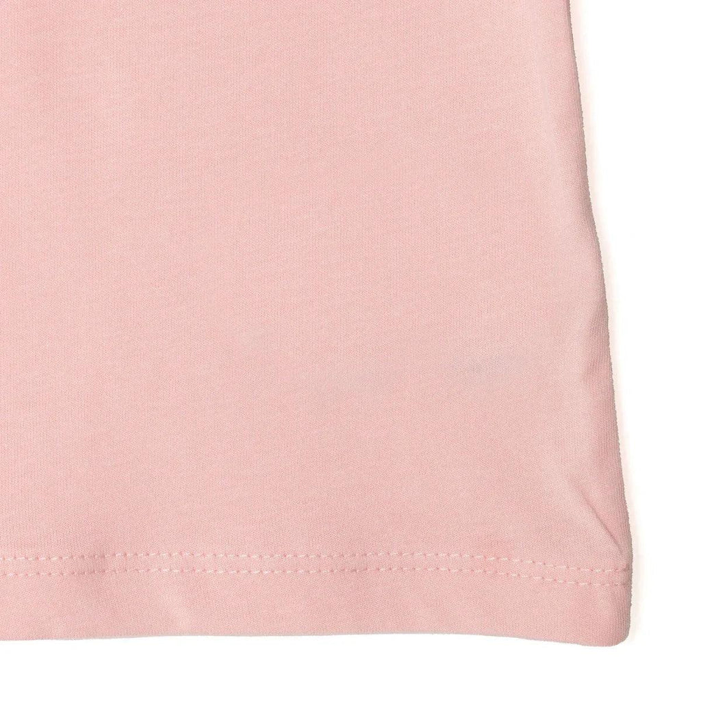 Powder pink jersey baby top hem with neat stitched finishing
