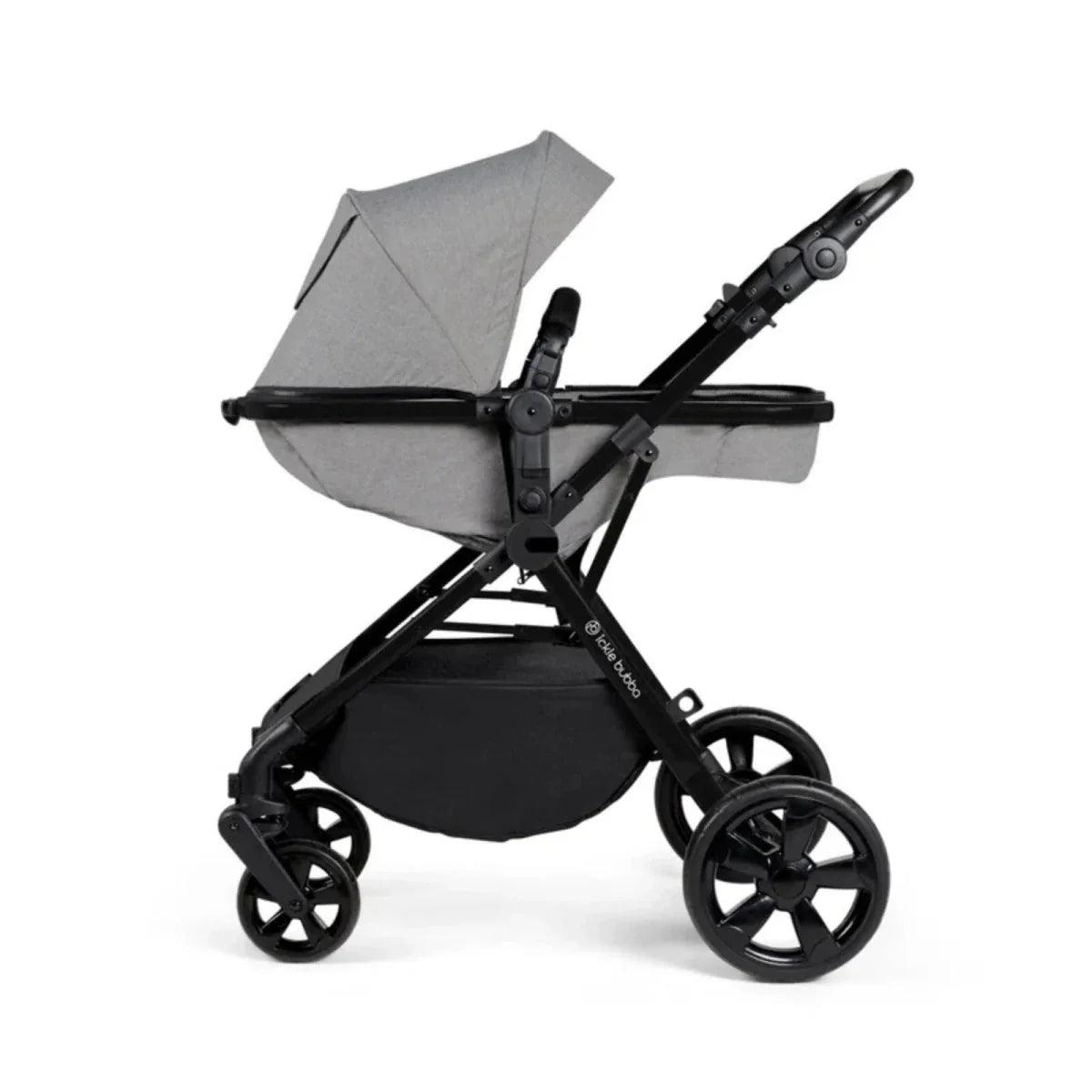Space grey stroller with canopy extended and padded seat; black frame and wheels
