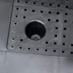 Close-up of planter self-watering base with circular reservoir and drainage openings