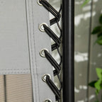 Grey mesh back panel with black support straps on a zero-gravity chair frame