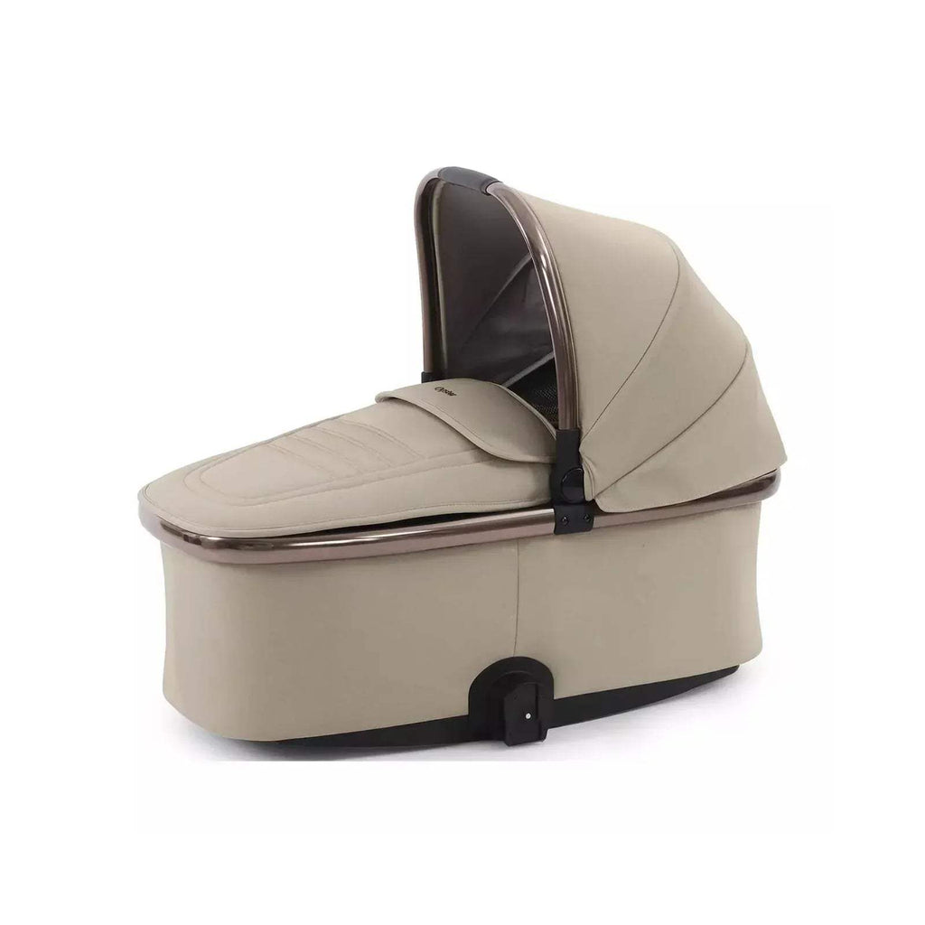 Buttermilk stroller carrycot with padded base and curved hood, shiny trim and foot flap
