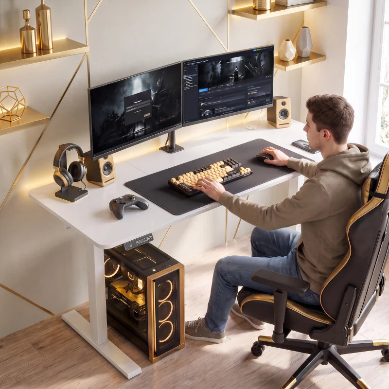 White standing desk in home office with dual monitors and keyboard on desktop