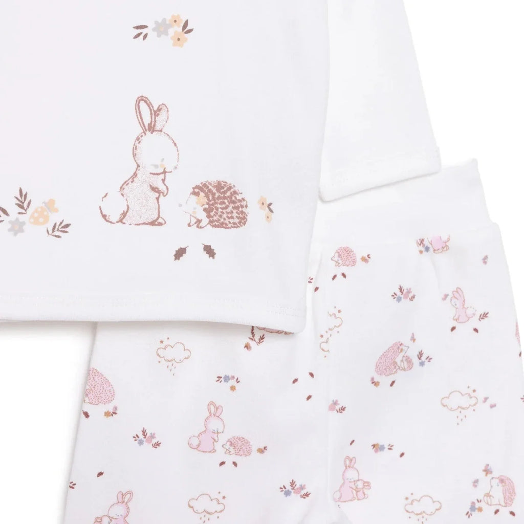 Ecru long-sleeve top and pajama pants with pink rabbits, hedgehogs, and flowers