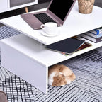 White coffee table with open shelf and countertop items, aluminum legs