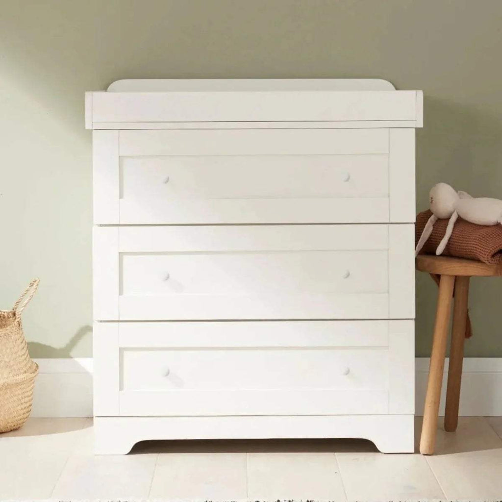 White chest changer with three drawers and top changing rail