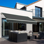 Dark grey retractable awning over patio seating with scalloped front edge.