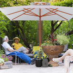 Grey square canopy parasol with open canopy, wooden pole, and orange cross-braced ribs.