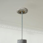 Light grey cat tree top pad on a tension rod with small metal connector
