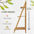 Folded bamboo plant stand frame with angled legs and upright storage position