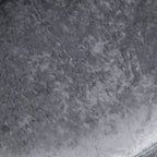 Grey ice-velvet fabric texture with mottled pattern