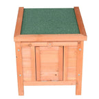 Wooden guinea pig hutch with green padded top and double front doors in natural wood
