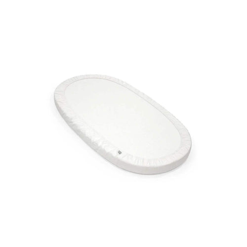 White oval fitted sheet with gathered elastic hem along the edge