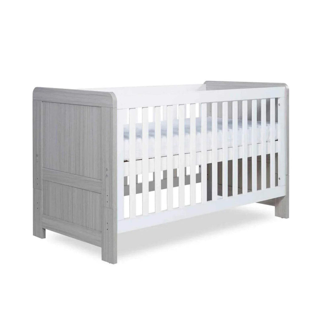 Ash grey cot bed with white vertical slats and paneled headboard
