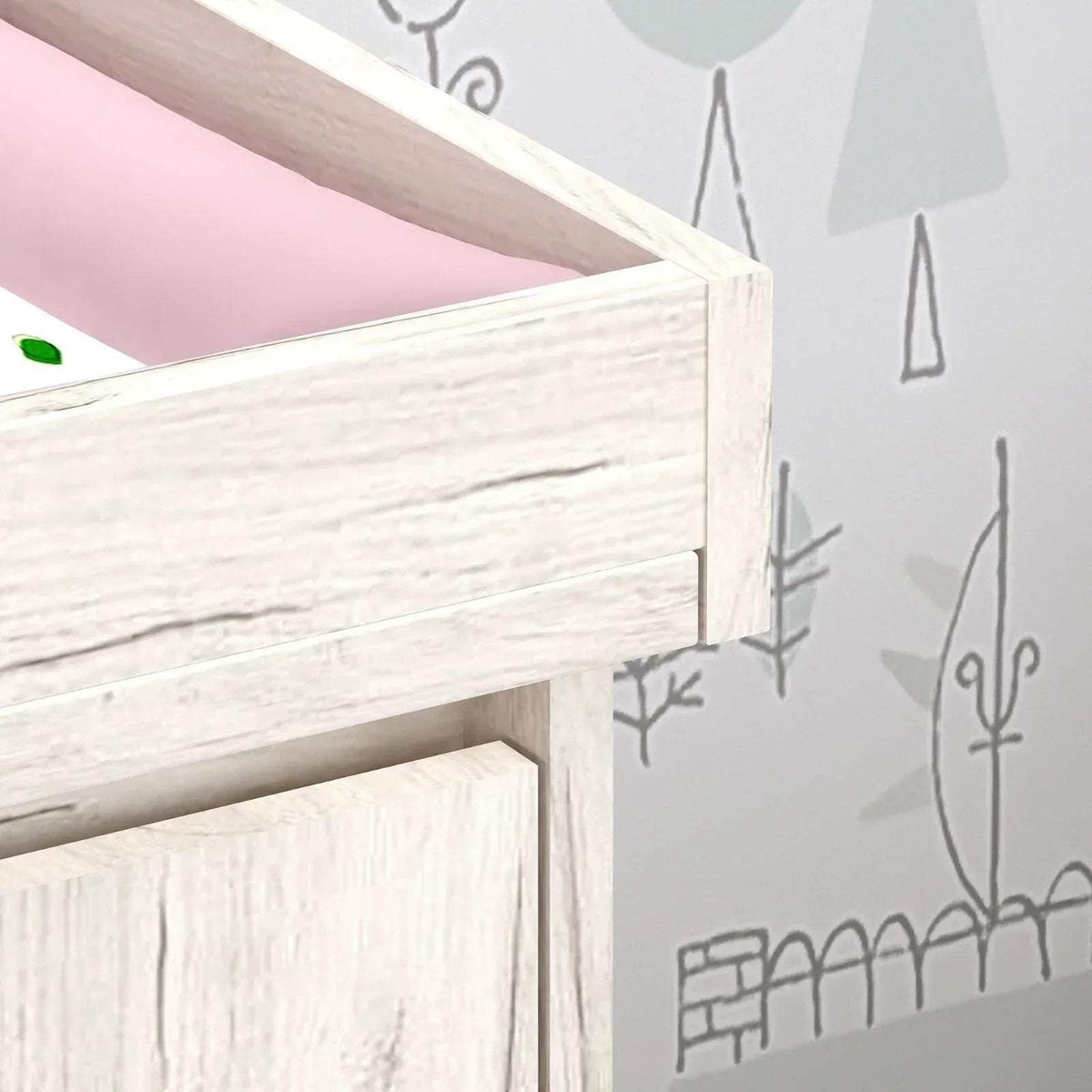 Close-up of white baby changing unit corner edge and smooth wood finish