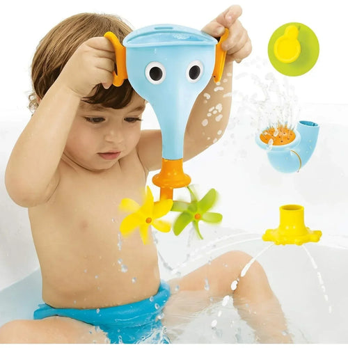 Light blue elephant bath funnel toy in a child’s hands with water splashes