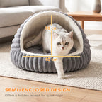 Grey round cat cave bed with cream lining and front opening; kitten inside