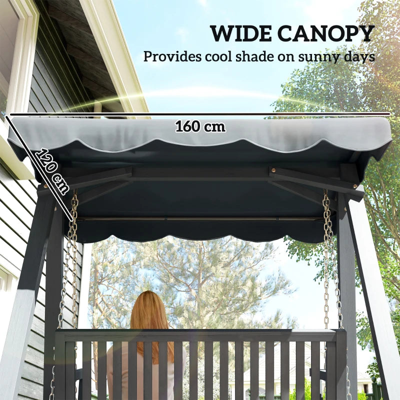 Grey canopy over wooden swing bench with scalloped edge and chain suspension