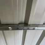 Grey metal shed floor foundation frame with cross braces under the base