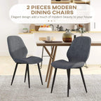 Set of 2 grey velvet dining chairs with curved backs and black metal legs