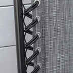Close-up of black frame lacing on grey mesh chair back