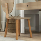 Kids desk and chair set shown from side; woven chair seat with natural wood frame