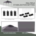 Dark gray pop-up gazebo with four leg weight bags, guy ropes, and ground stakes