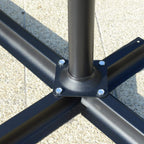 Dark grey cantilever umbrella cross base with metal support feet on the ground