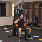 Black multifunction home gym machine with seated lat pulldown setup and weight stack