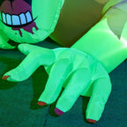 Green inflatable zombie ghost legs and hands on the ground with LED illumination