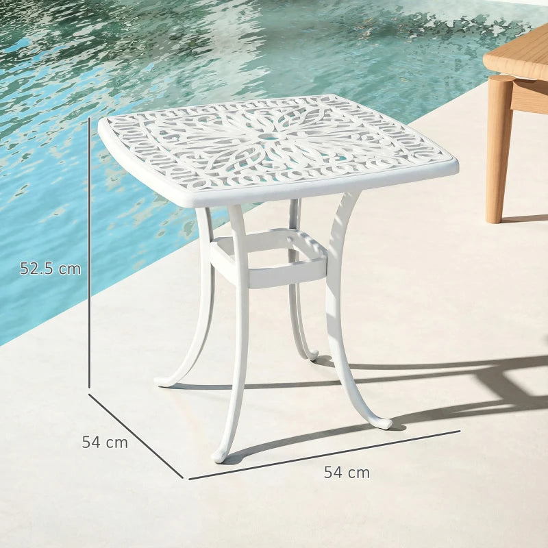 White cast aluminium patio end table with lattice tabletop, center umbrella hole, curved legs