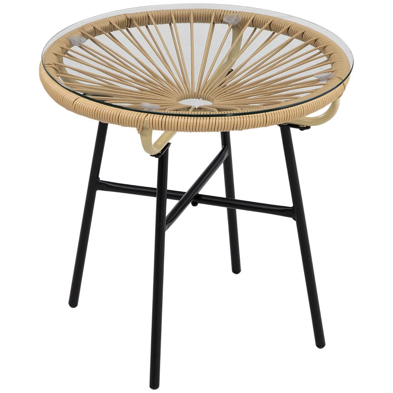 Beige round rattan side table with clear tempered glass top and black metal legs
