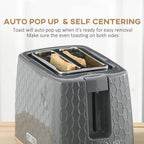 Grey 2-slice toaster with bread in slots and self-centering open top