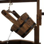 Wooden barrel water pump spout with steel band and dripping water