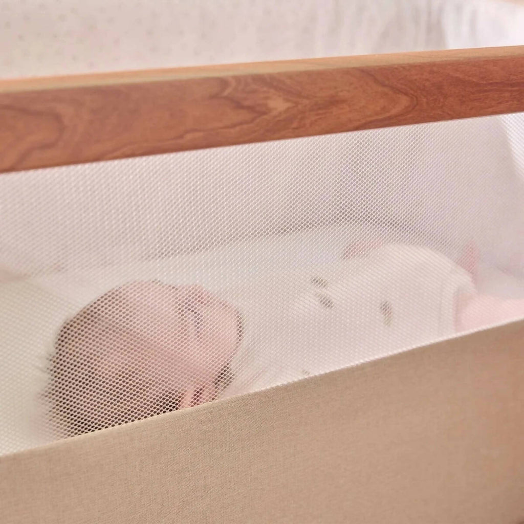 Breathable mesh panel inside ecru bedside crib