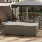 Grey waterproof furniture cover over outdoor seating on wooden deck