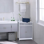 Grey and white freestanding bathroom cabinet with drawers and double doors beside wall sink