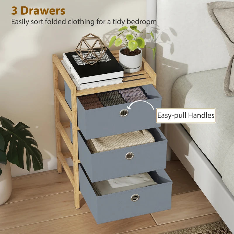 Light grey fabric drawer dresser with bamboo frame, three open drawers and round pulls