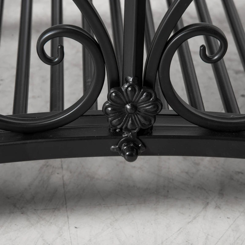 Black metal bridge crossbar with ornate floral finial detail