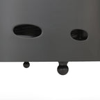 Underside of dark grey fire pit with vent openings and support feet