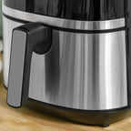 Black air fryer front drawer with long handle and stainless steel interior