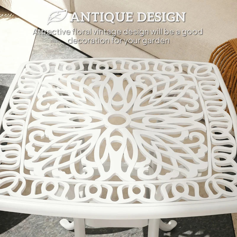 White cast aluminium end table with ornate floral lattice tabletop and central umbrella hole