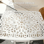White cast aluminium end table with ornate floral lattice tabletop and central umbrella hole