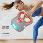 Grey 14 kg kettlebell with red handle, showing flat base and round 14 KG label.