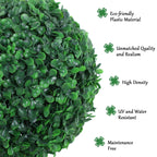 Close-up of dense artificial green foliage ball with glossy leaf texture