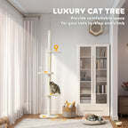 Beige cat tree tower with stacked perches and dangling play balls in a living room