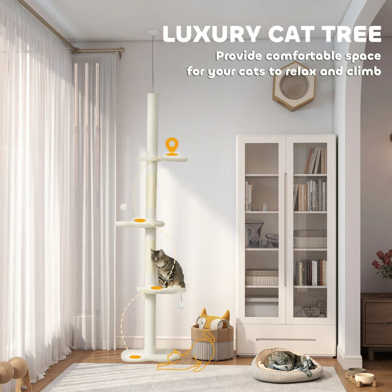 Beige cat tree tower with stacked perches and dangling play balls in a living room