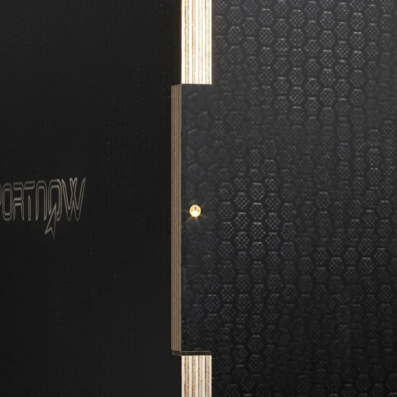 Close-up side of black wooden jump box with light wood frame and brass dots