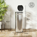 Silver stainless steel sensor trash bin standing upright with black round lid