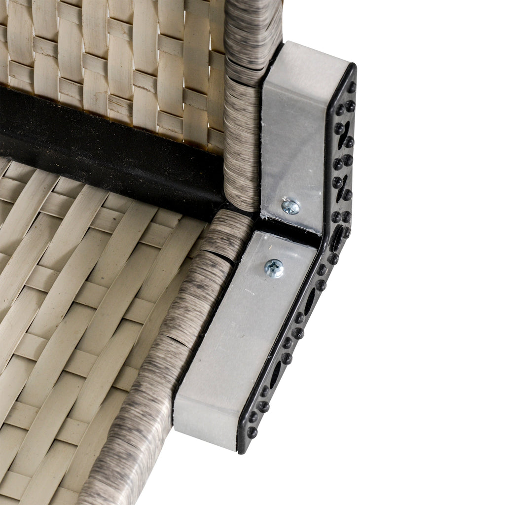 Close-up of the wicker table's metal support bracket and woven frame